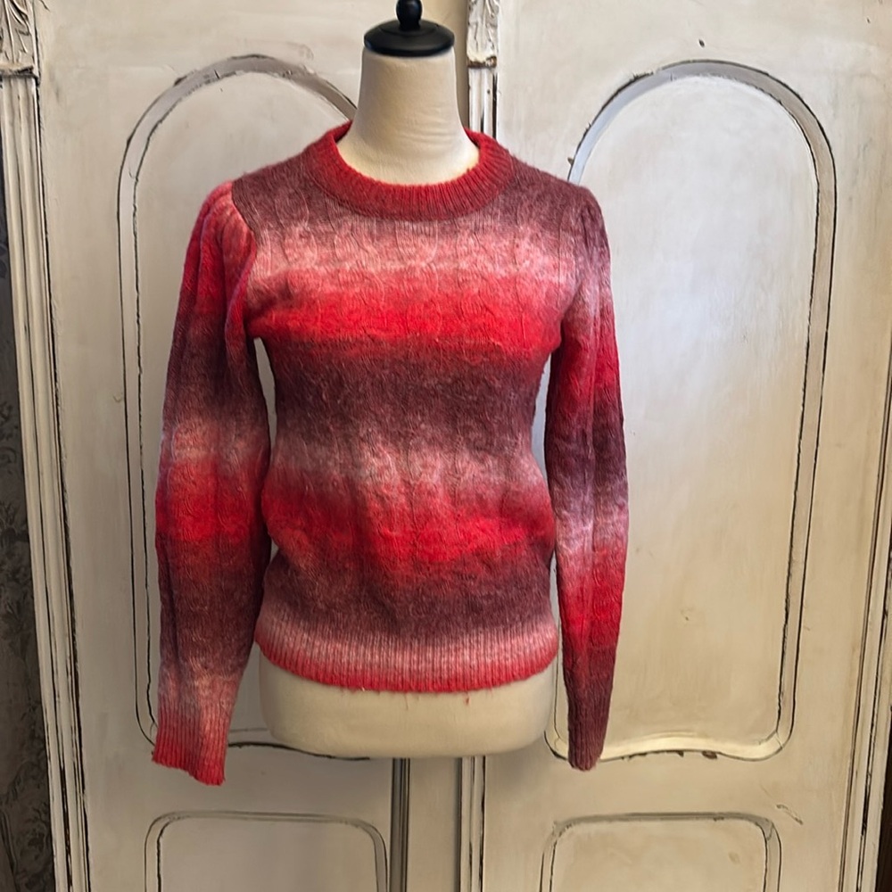 Central Park West stylish cable knit sweater in ombré shades.